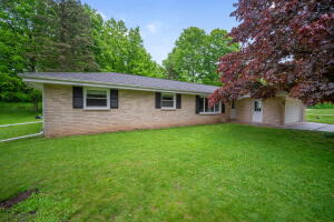 Big Cedar Lake home for sale at 5800  Schneider Ct in West Bend Wisconsin