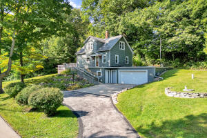 Milwaukee River home for sale at 7107  River Dr in Barton Wisconsin